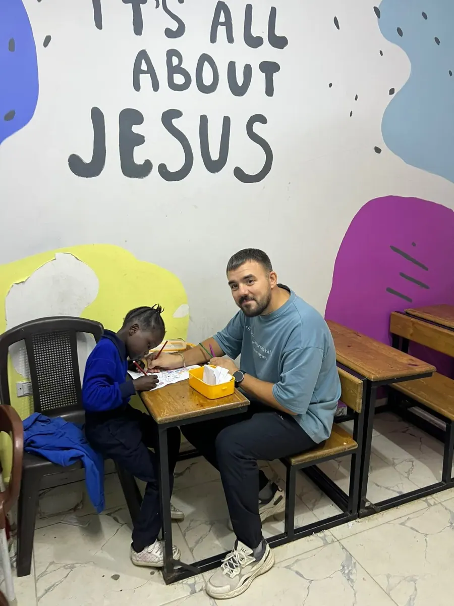 Missionary teaching a child at our Cairo outreach center — Mission Sons of God