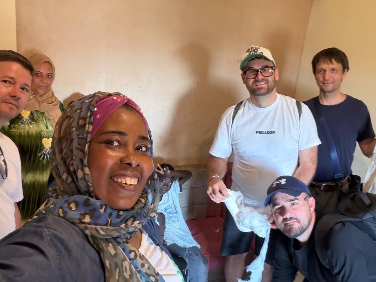 Sudanese refugee family with mission team in Cairo