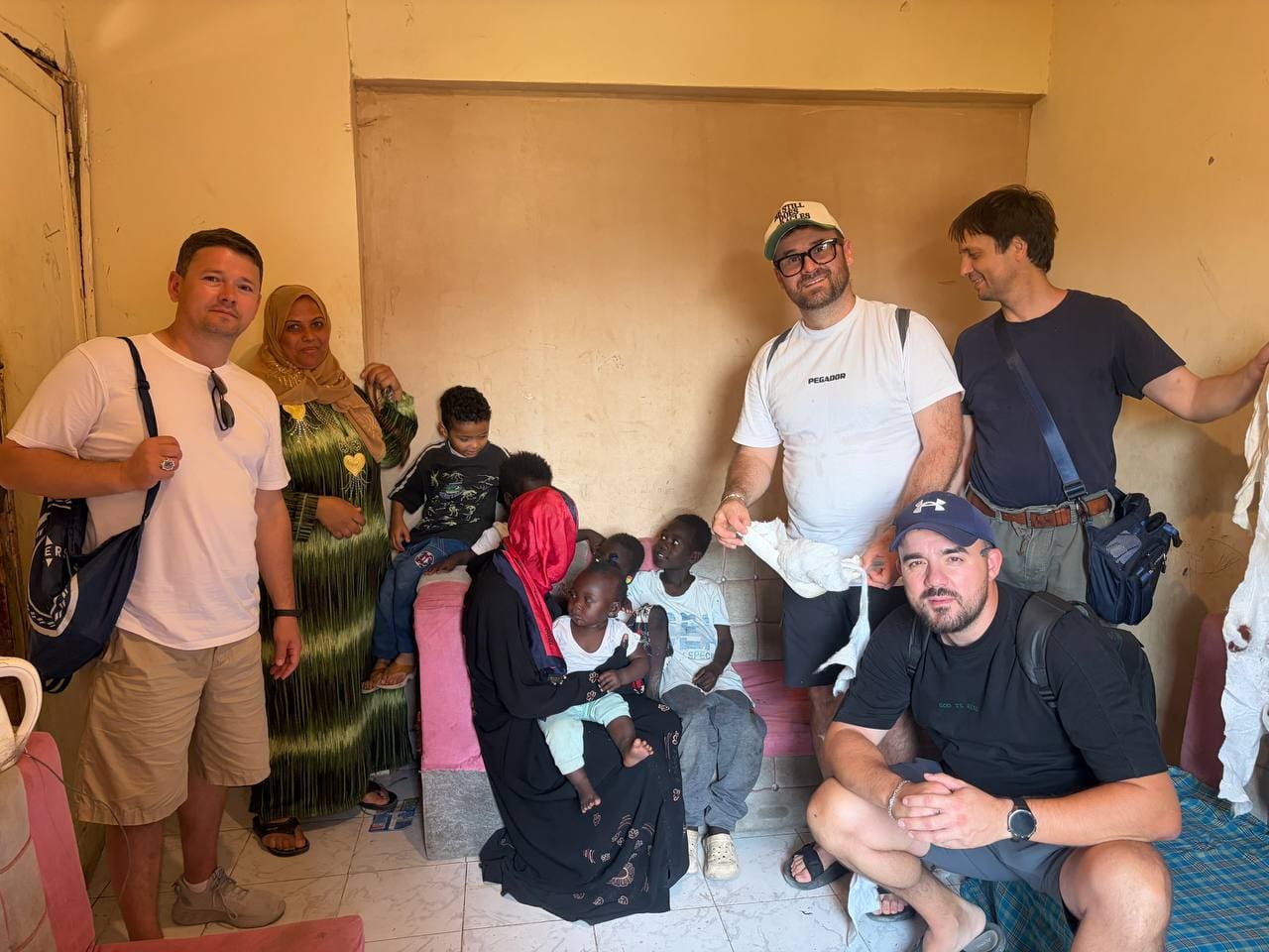 Mission team distributing supplies in Sudanese home